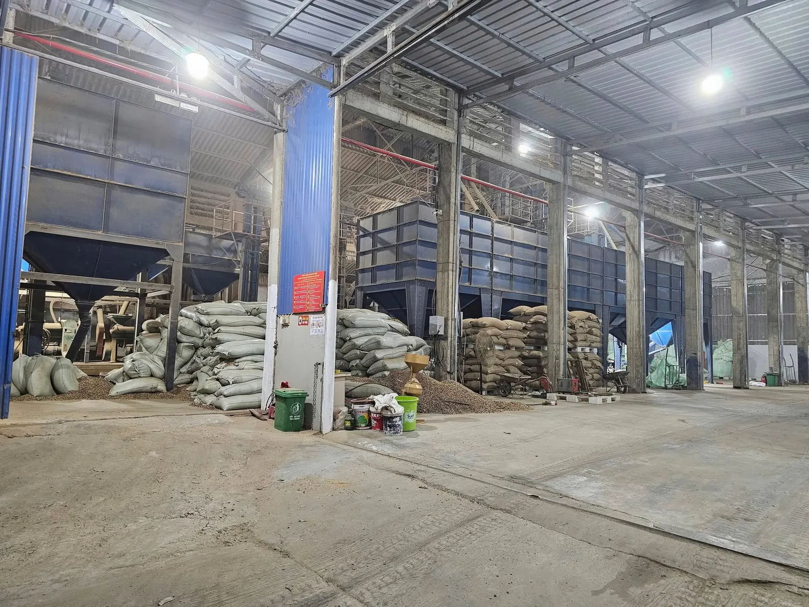 The processing floor, with silos and bagged coffee